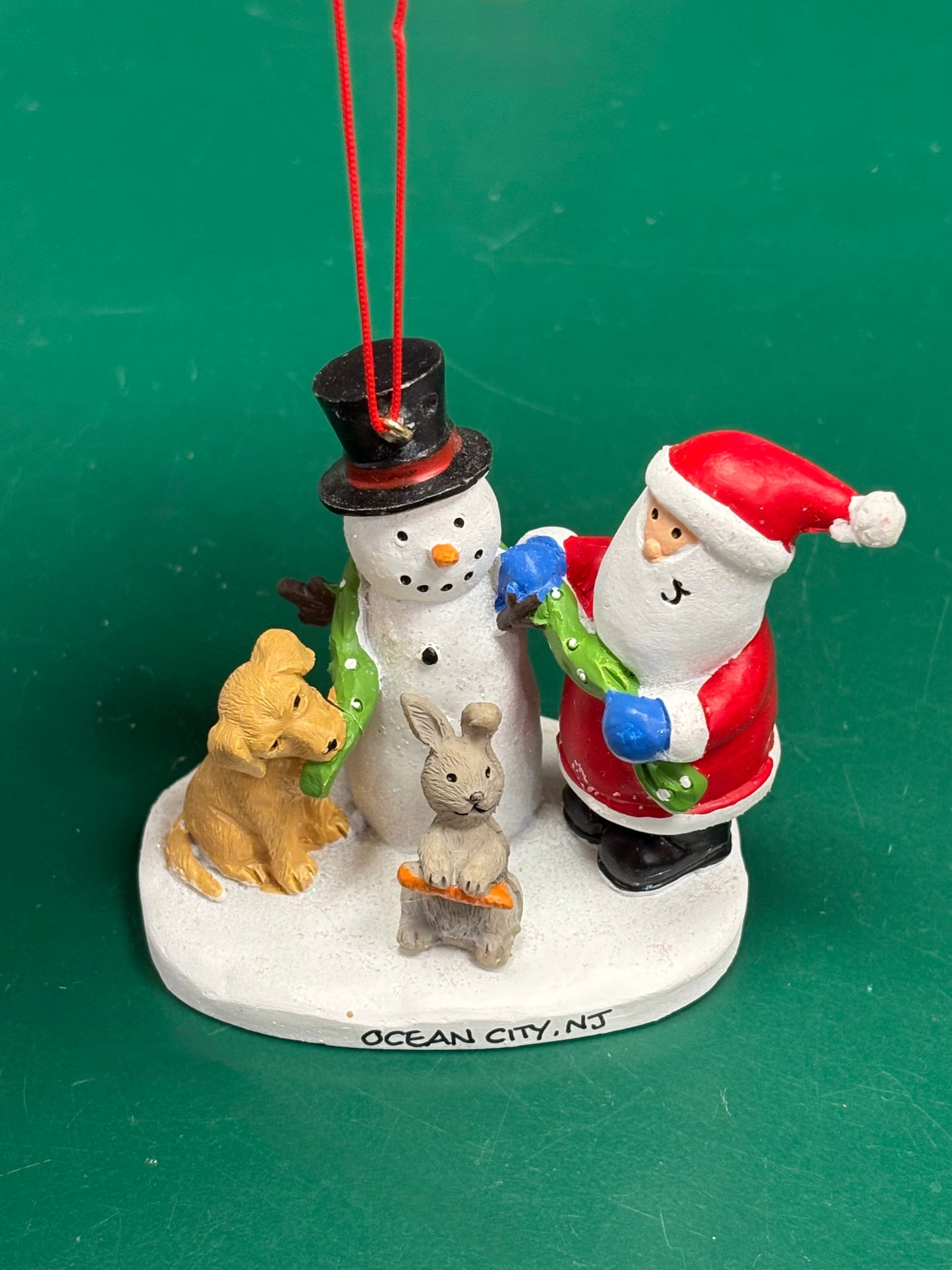 Santa & Puppy Building a Snowman Ornament